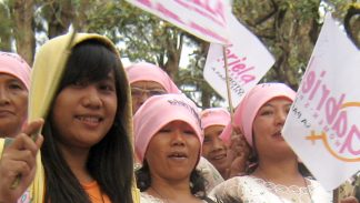 Young woman leads a protest for food security and sustainability in the Philippines