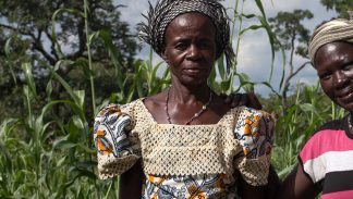 Yeri and women in her community in their cornfield