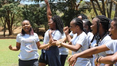 Women celebrate and raise their fists